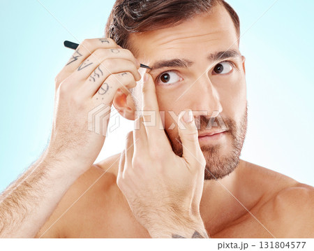 Hair removal, eyebrows and tweezers with face of man for grooming, hygiene and beauty. Cosmetology, treatment and facial growth with model and tool for morning routine, trimming and cleaning Hair removal, eyebrows and tweezers with face of man for grooming, hygiene and beauty. Cosmetology, treatment and facial growth with model and tool for morning routine, trimming and cleaning 131804577