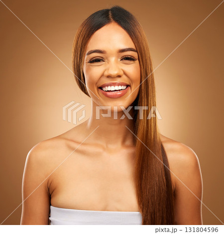 Smile, beauty and hair care portrait of woman in studio for growth, color shine or healthy texture. Happy female face for haircare, natural makeup and hairdresser or salon on brown background Smile, beauty and hair care portrait of woman in studio for growth, color shine or healthy texture. Happy female face for haircare, natural makeup and hairdresser or salon on brown background 131804596