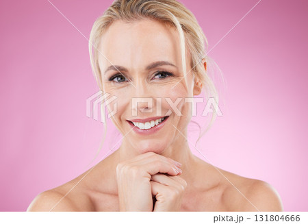 Skincare, makeup and portrait of woman with smile, glowing skin and natural beauty in studio. Mockup, advertising and beauty, luxury cosmetics, face of happy blonde model isolated on pink background. Skincare, makeup and portrait of woman with smile, glowing skin and natural beauty in studio. Mockup, advertising and beauty, luxury cosmetics, face of happy blonde model isolated on pink background. 131804666