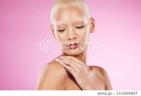 Face, beauty skincare and black woman in studio isolated on a pink background. Makeup, cosmetics and young female model or girl with glowing, healthy and flawless skin after spa facial treatment. 131804807