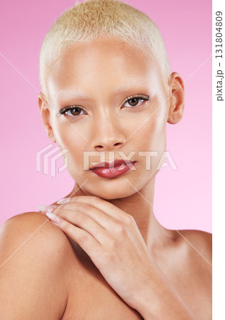 Portrait, face and makeup with a model black woman in studio on a pink background for edgy cosmetics. Beauty, skincare or natural with a unique and attractve young female indoor for cosmetic care Portrait, face and makeup with a model black woman in studio on a pink background for edgy cosmetics. Beauty, skincare or natural with a unique and attractve young female indoor for cosmetic care 131804809