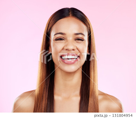 Portrait, hair and happy with a model black woman smiling in studio on a pink background for beauty. Face, haircare and keratin with an attractive young female in the salon for a shampoo treatment 131804954