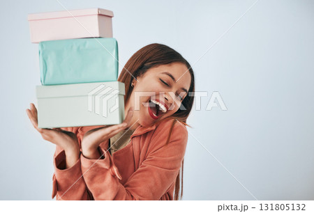 Gift box, excited and studio woman with shopping sales product, discount fashion deal or mall store present. Commerce market, retail person and happy customer celebrate on mockup grey background Gift box, excited and studio woman with shopping sales product, discount fashion deal or mall store present. Commerce market, retail person and happy customer celebrate on mockup grey background 131805132
