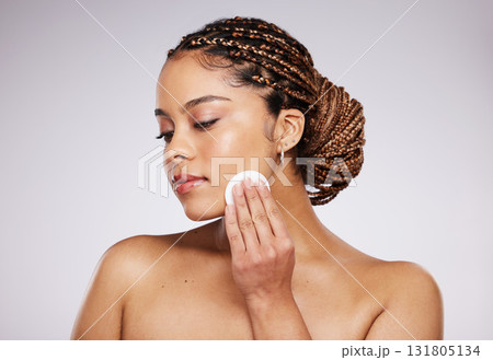 Skincare, beauty or woman with cotton pad for dermatology, wellness and healthy skin on studio background. Spa aesthetic, beauty and face of girl with swab for makeup, facial treatment and cosmetics Skincare, beauty or woman with cotton pad for dermatology, wellness and healthy skin on studio background. Spa aesthetic, beauty and face of girl with swab for makeup, facial treatment and cosmetics 131805134