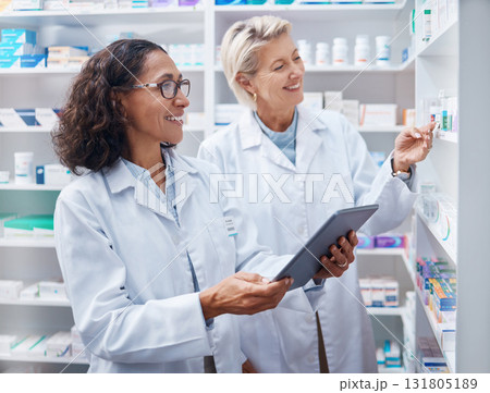 Tablet, teamwork and pharmacist check stock in pharmacy, drugstore or medication shop. Medicine, technology and medical doctors or happy senior women with touchscreen for checking product inventory. 131805189