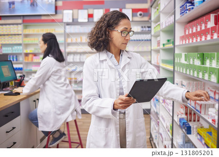 Pharmacy product, tablet and pharmacist woman for medicine management, stock research and inventory. Digital technology, retail logistics and healthcare doctor or person with pharmaceutical database Pharmacy product, tablet and pharmacist woman for medicine management, stock research and inventory. Digital technology, retail logistics and healthcare doctor or person with pharmaceutical database 131805201