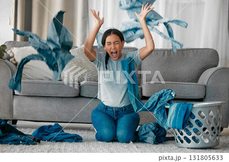 Laundry, angry and woman with clothes in air frustrated from cleaning, housekeeping and housework. Burnout, washing basket and upset, stressed and shouting female maid in living room throw clothing Laundry, angry and woman with clothes in air frustrated from cleaning, housekeeping and housework. Burnout, washing basket and upset, stressed and shouting female maid in living room throw clothing 131805633