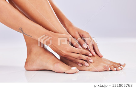 Closeup, skincare and legs with beauty, dermatology and wellness against a studio background. Feet, female and woman with hair removal, salon treatment and luxury with grooming, smooth and soft skin Closeup, skincare and legs with beauty, dermatology and wellness against a studio background. Feet, female and woman with hair removal, salon treatment and luxury with grooming, smooth and soft skin 131805768