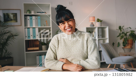 Happy, smile and portrait of woman in the office with good, positive and confident attitude. Happiness, pride and young female designer from Colombia working by her desk in her modern workplace. 131805982