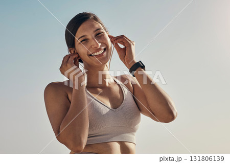 Fitness, portrait and music for woman at a beach for running, training and cardio on sky background. Happy, face and radio for girl on mockup for exercise, wellness and motivation with podcast track 131806139
