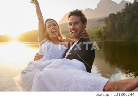 Wedding, lake and groom carrying bride in nature and water with passion, smile and romance. Marriage, excited happy couple celebrate love and romantic relationship, loving man and woman together. Wedding, lake and groom carrying bride in nature and water with passion, smile and romance. Marriage, excited happy couple celebrate love and romantic relationship, loving man and woman together. 131806244