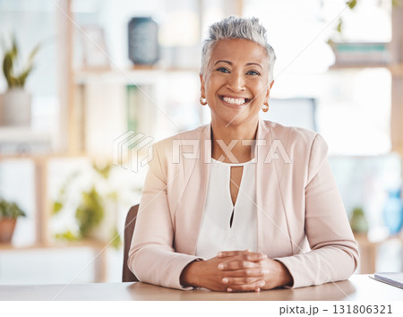 Leadership, portrait and business woman in her office sitting at a desk of a corporate company. Happy, career and face of confident professional senior female executive ceo with a smile in workplace. 131806321