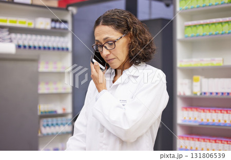 Phone call, pharmacy and medicine with a woman taking an order in a drugstore for prescription or treatment. Mobile, contact and healthcare with a female pharmacist talking in a hospital dispensary Phone call, pharmacy and medicine with a woman taking an order in a drugstore for prescription or treatment. Mobile, contact and healthcare with a female pharmacist talking in a hospital dispensary 131806539