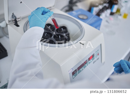 Hands, test tube or laboratory centrifuge in science research, person dna engineering or data analytics. Zoom, scientist or blood vial in medical equipment, particles separation or vaccine innovation Hands, test tube or laboratory centrifuge in science research, person dna engineering or data analytics. Zoom, scientist or blood vial in medical equipment, particles separation or vaccine innovation 131806652