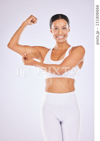 Health, skincare and woman pinch muscle for strong body, wellness and exercise on studio background. Beauty, fitness and portrait of happy girl flexing in underwear for workout, diet and weight loss Health, skincare and woman pinch muscle for strong body, wellness and exercise on studio background. Beauty, fitness and portrait of happy girl flexing in underwear for workout, diet and weight loss 131806666
