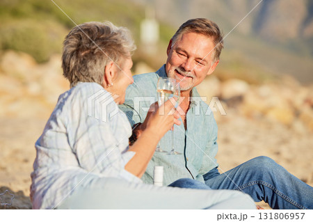 Champagne, beach and love celebration of mature couple with care and support of marriage. Toast, wine and sea picnic of a old man and woman together on holiday in summer loving the sunshine outdoor Champagne, beach and love celebration of mature couple with care and support of marriage. Toast, wine and sea picnic of a old man and woman together on holiday in summer loving the sunshine outdoor 131806957