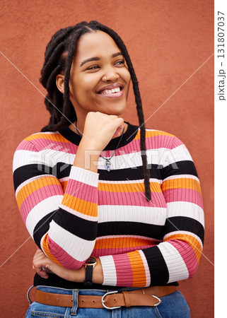 Thinking, vision and black woman with idea for empowerment, confident and contemplation on orange wall background. Contemplating, emoji and pensive girl in studio, happy or smile on product placement 131807037