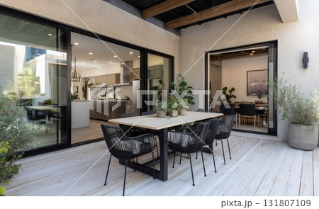 Modern Outdoor Dining Area With Scenic View in Contemporary Home at Midday Modern Outdoor Dining Area With Scenic View in Contemporary Home at Midday 131807109