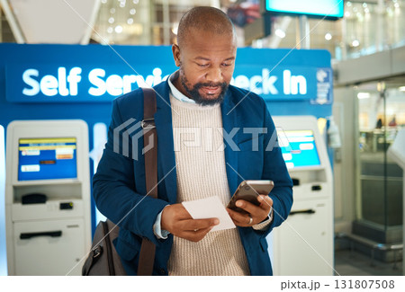 Black man, plane ticket self check in and phone app with international airport information for travel. Flight data, businessman and luggage of a African employee reading mobile info for airplane Black man, plane ticket self check in and phone app with international airport information for travel. Flight data, businessman and luggage of a African employee reading mobile info for airplane 131807508
