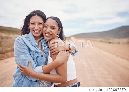 Portrait, hug and friends on a road trip with mockup on a dirt road outdoor in nature for adventure together. Desert, travel or freedom with a young woman and friend hugging outsode on holiday 131807679