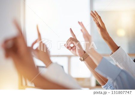 Seminar, diversity and business people raise hands to ask a question at training in the office. Group, multiracial and professional employees at a corporate tradeshow or conference in the workplace. 131807747