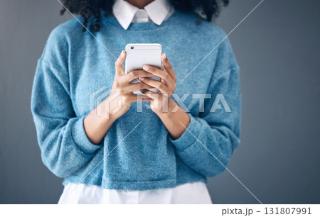 Phone, hands or black woman search in studio for social media content, networking or reading blog post update. Website, startup or girl with smartphone for communication, internet news or mobile app Phone, hands or black woman search in studio for social media content, networking or reading blog post update. Website, startup or girl with smartphone for communication, internet news or mobile app 131807991