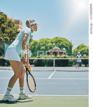 Tennis, woman and sports match on court for fitness, exercise and training for competition. Person serving at club for game, workout and performance for health and wellness with summer cardio outdoor Tennis, woman and sports match on court for fitness, exercise and training for competition. Person serving at club for game, workout and performance for health and wellness with summer cardio outdoor 131808004