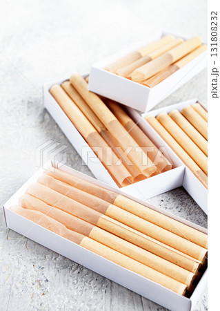 cigarette casings, packed in boxes, on the table, top view, 131808232