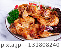 Baked quail, served on a plate with crispy lettuce leaves, fresh tomatoes and herbs, on a white plate, homemade, 131808240