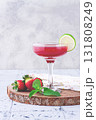 Refreshing cocktail in an elegant glass with lime and strawberries, sunshine, no people, 131808249