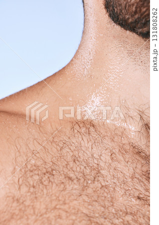 Water drops, wet torso and closeup man in shower for cleaning, care and wellness on background. Beauty, human body and hairy chest in studio for washing, grooming and hygiene cosmetics for skincare Water drops, wet torso and closeup man in shower for cleaning, care and wellness on background. Beauty, human body and hairy chest in studio for washing, grooming and hygiene cosmetics for skincare 131808262