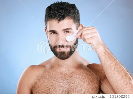 Skincare, eyes patch and portrait of man, beauty and dermatology on studio background. Male model, face and eye care product for body mask, healthy cosmetics and wellness of facial collagen treatment Skincare, eyes patch and portrait of man, beauty and dermatology on studio background. Male model, face and eye care product for body mask, healthy cosmetics and wellness of facial collagen treatment 131808293