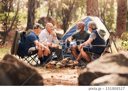 Senior people, camping and relaxing in nature for travel, adventure or summer vacation together on chairs by tent in forest. Group of elderly men talking, enjoying camp out conversation in the woods 131808527