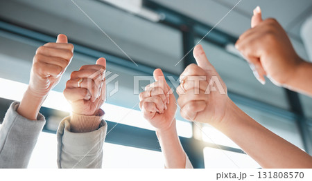 Hands, thumbs up and collaboration with a business team in celebration together at the office from below. Winner, teamwork or gesture with a man and woman employee group celebrating at work closeup Hands, thumbs up and collaboration with a business team in celebration together at the office from below. Winner, teamwork or gesture with a man and woman employee group celebrating at work closeup 131808570