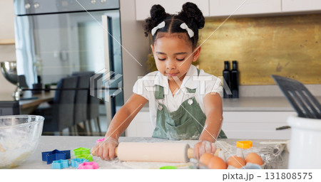 Girl, kitchen and rolling pin for cooking, dough and learning with development, skills or ready for cookies. Child baker, flour and pastry in family home for food, dessert or snack with preparation Girl, kitchen and rolling pin for cooking, dough and learning with development, skills or ready for cookies. Child baker, flour and pastry in family home for food, dessert or snack with preparation 131808575