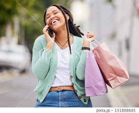 Fashion, phone call or happy black woman shopping, talking or walking on city street in retail therapy. Freedom, relax or funny gen z girl laughing with clothes or products on discounted sales offer 131808685