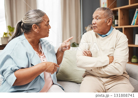 Senior couple, fight and angry on sofa for marriage problems, conflict and communication. Divorce, argument and frustrated partner of man, woman and people in anger, living room and blame of affair Senior couple, fight and angry on sofa for marriage problems, conflict and communication. Divorce, argument and frustrated partner of man, woman and people in anger, living room and blame of affair 131808741