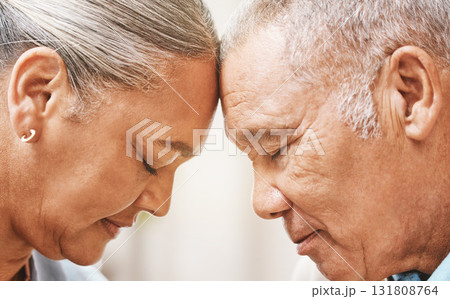 Face, love and support with a senior couple in their home, touching heads in trust or solidarity together. Relax, peace or romance with a mature man and woman bonding in their house during retirement Face, love and support with a senior couple in their home, touching heads in trust or solidarity together. Relax, peace or romance with a mature man and woman bonding in their house during retirement 131808764