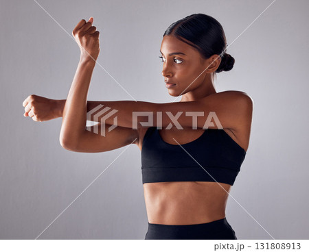 Exercise, health and studio woman stretching for cardio fitness running, marathon training or body healthcare goals. Performance workout start, wellness or athlete warm up isolated on grey background 131808913