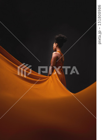 Black woman, art and fashion, fabric with mockup on dark background with beauty and aesthetic movement. Flowing silk, fantasy and artistic African model in creative designer dress in studio from back 131808986