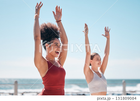 Yoga, chakra and beach with woman friends outdoor together in nature for wellness training. Exercise, fitness or zen with a female yogi and friend outside for a mental health workout by the ocean 131809084