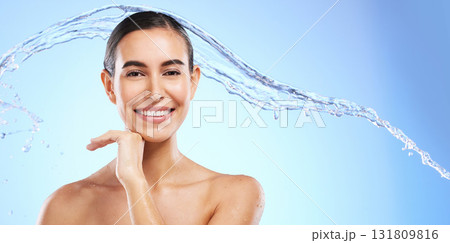Water splash, skincare portrait or happy woman with smile or smiling female model face on studio background. Dermatology cosmetics or beautiful girl with facial treatment, beauty or glowing results 131809816