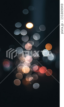 Colorful Bokeh Lights Create a Dreamy Atmosphere at Night in an Urban Setting 131809949