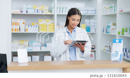 Healthcare, tablet and woman pharmacist doing research at dispensary for prescription medication. Medical, digital technology and female chemist check stock inventory for medicine in drugstore clinic Healthcare, tablet and woman pharmacist doing research at dispensary for prescription medication. Medical, digital technology and female chemist check stock inventory for medicine in drugstore clinic 131810043