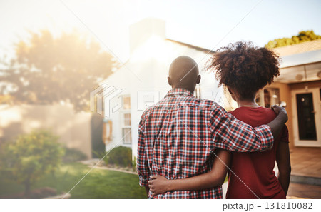 Back view, black couple and hug outdoor at house, real estate and new loan for luxury home. Man, woman and people in front of property investment, moving and dream neighborhood for building mortgage 131810082