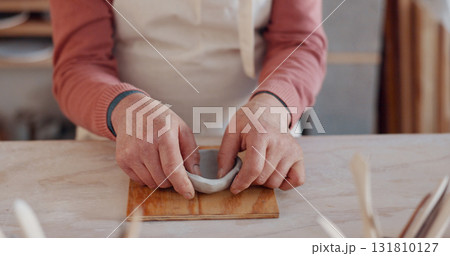 Bowl, hands of artist and pottery closeup in studio, workshop craft and small business of creative manufacturing. Ceramic designer, clay artisan and sculpture in class, mud mold and handmade process Bowl, hands of artist and pottery closeup in studio, workshop craft and small business of creative manufacturing. Ceramic designer, clay artisan and sculpture in class, mud mold and handmade process 131810127