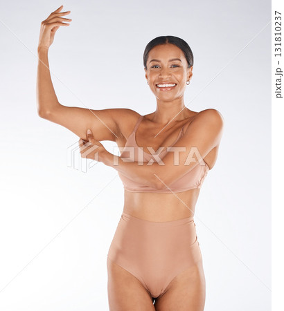 Health, muscle flex and portrait of black woman on white background with smile, body wellness and beauty. Fitness, exercise and girl excited for weight loss, healthy lifestyle and progress in studio 131810237