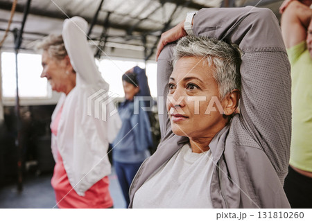 Senior women, stretching arms and group for health, fitness or wellness for focus, support and motivation. Old woman, team workout and muscle development in retirement with exercise, mindset and goal Senior women, stretching arms and group for health, fitness or wellness for focus, support and motivation. Old woman, team workout and muscle development in retirement with exercise, mindset and goal 131810260