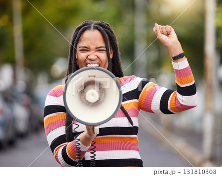 Megaphone, city or black woman in protest with speech announcement for politics, equality or human rights. Feminist leader, anger or angry girl speaker fighting or shouting for justice on street road Megaphone, city or black woman in protest with speech announcement for politics, equality or human rights. Feminist leader, anger or angry girl speaker fighting or shouting for justice on street road 131810308