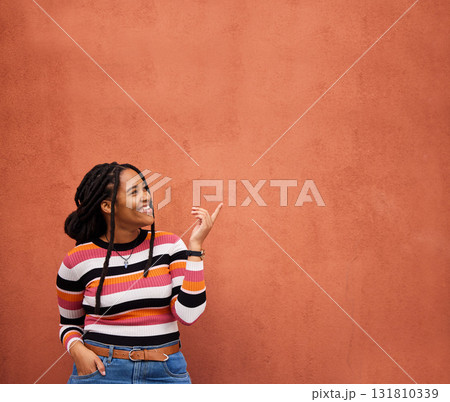 Mockup, pointing or black woman with marketing, product placement or branding space on wall background. Smile or African gen z girl advertising discount deal, sales offer or promotion announcement Mockup, pointing or black woman with marketing, product placement or branding space on wall background. Smile or African gen z girl advertising discount deal, sales offer or promotion announcement 131810339